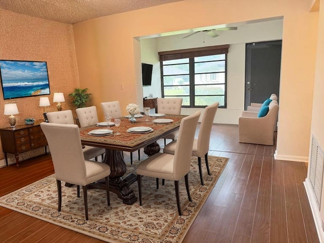 4908 Eaglewood Rd Unit A, Boynton Beach, FL 33436 - dining room featuring ceiling fan, a textured ceiling, wood-type flooring, and baseboards