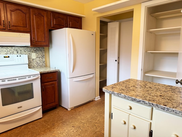 4908 Eaglewood Rd Unit A, Boynton Beach, FL 33436 - kitchen featuring under cabinet range hood, white appliances, light stone counters, open shelves, and backsplash