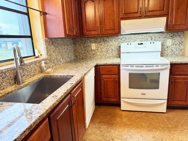 4908 Eaglewood Rd Unit A, Boynton Beach, FL 33436 - kitchen with a sink, white appliances, light stone counters, under cabinet range hood, and backsplash