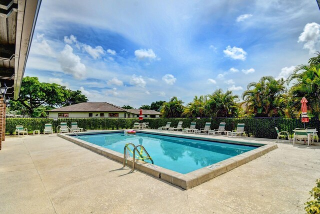 4908 Eaglewood Rd Unit A, Boynton Beach, FL 33436 - pool featuring a patio and fence