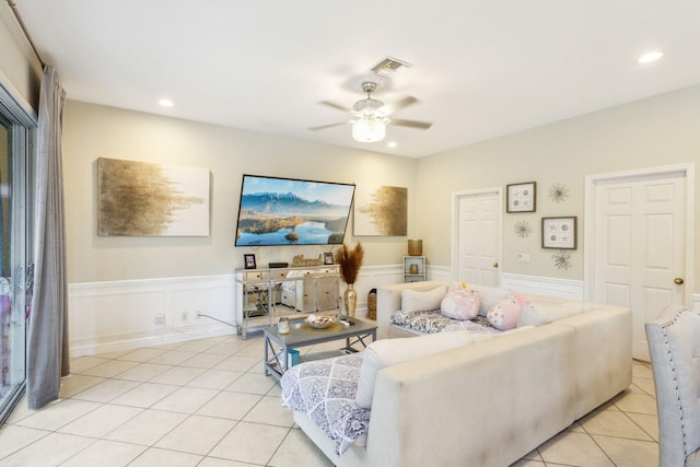 tiled living room featuring ceiling fan