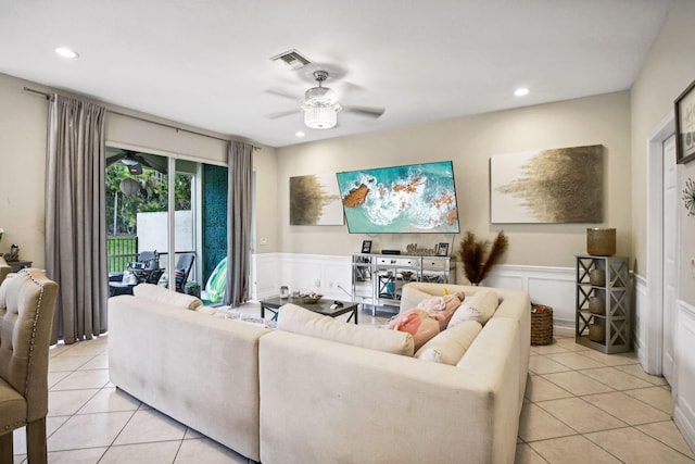 living room featuring ceiling fan and light tile patterned floors