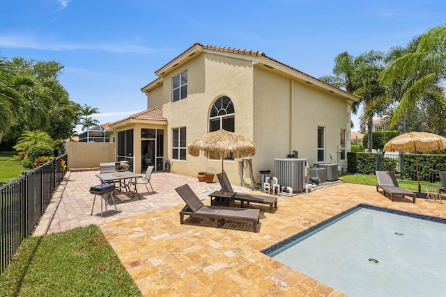 back of house featuring cooling unit and a patio area