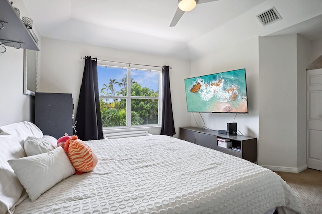 carpeted bedroom featuring ceiling fan and lofted ceiling