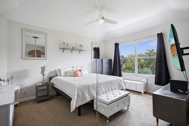 bedroom featuring ceiling fan, light carpet, and vaulted ceiling