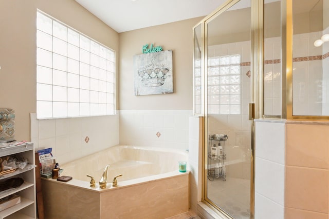 bathroom with shower with separate bathtub