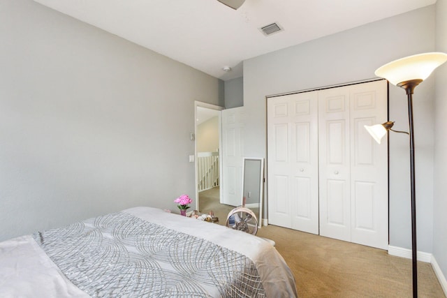 bedroom with carpet and a closet