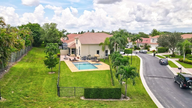 view of swimming pool featuring a lawn