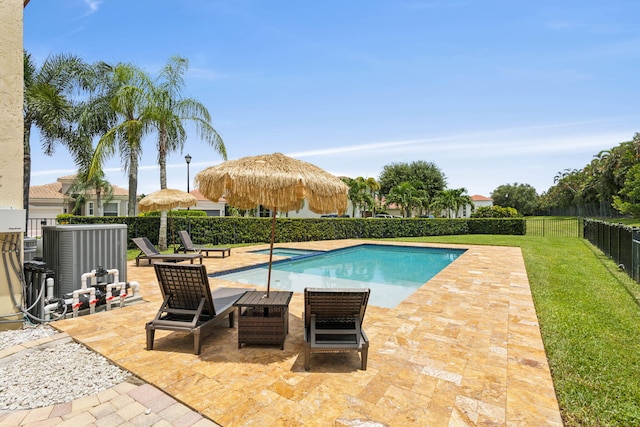 view of pool featuring a yard and a patio