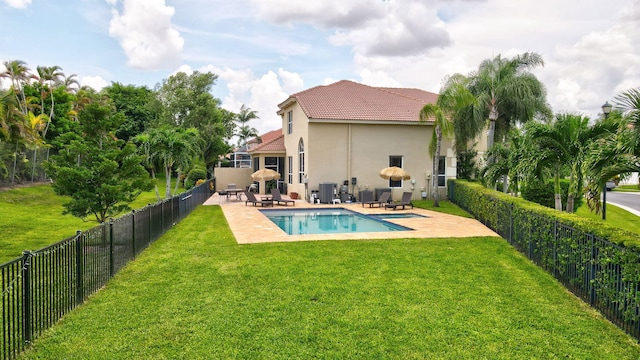 view of swimming pool featuring a patio area and a lawn