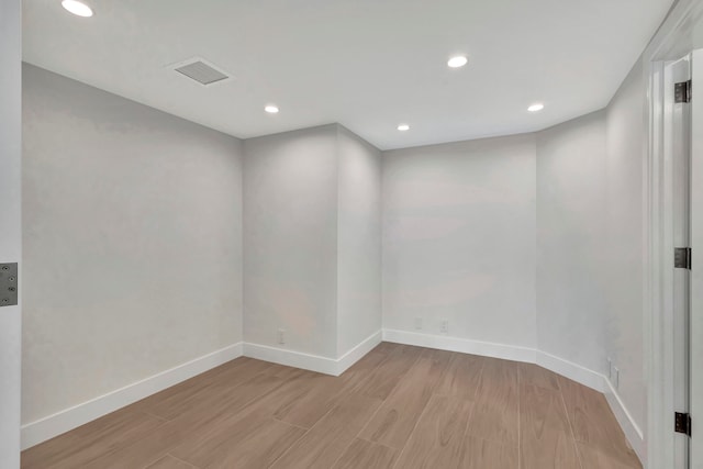 unfurnished room featuring light hardwood / wood-style flooring