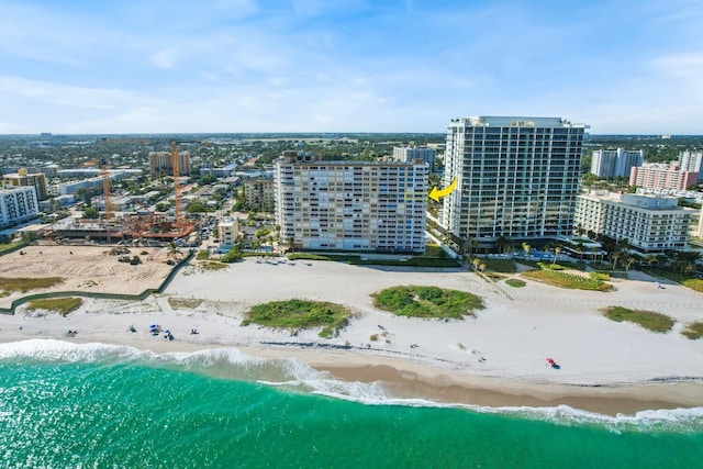 aerial view featuring a view of the beach and a water view