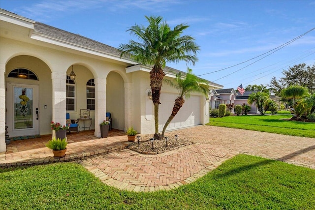 exterior space with a yard and a garage