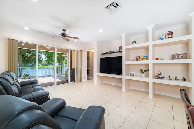 living room with light tile patterned flooring, built in features, crown molding, and ceiling fan