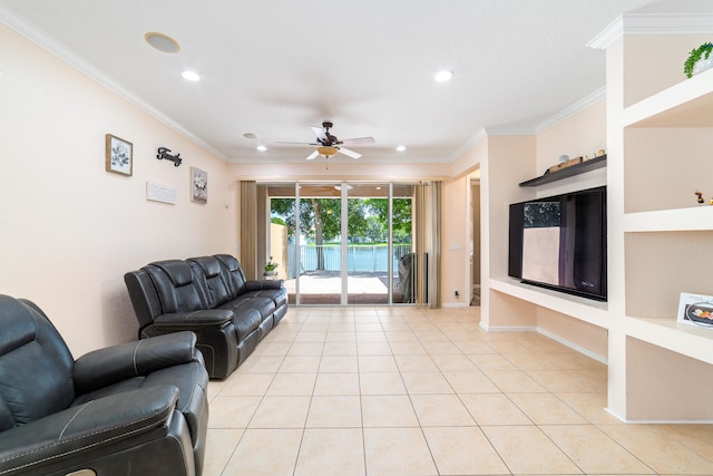 living room featuring built in features, crown molding, ceiling fan, and light tile patterned flooring