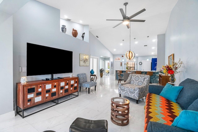 tiled living room with high vaulted ceiling and ceiling fan