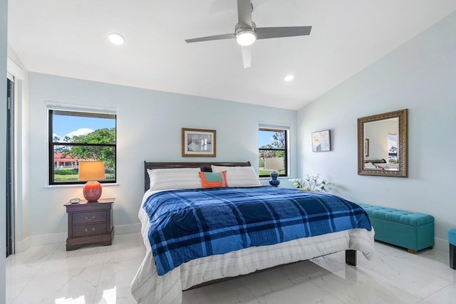 tiled bedroom featuring ceiling fan, multiple windows, and vaulted ceiling