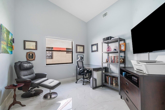 tiled home office with high vaulted ceiling