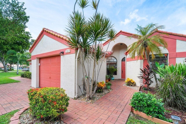 view of exterior entry featuring a garage