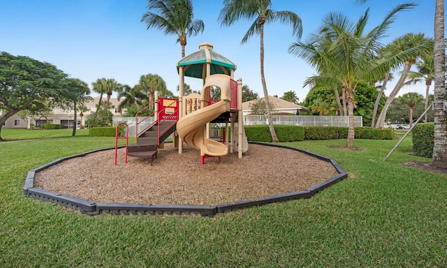 view of playground featuring a lawn