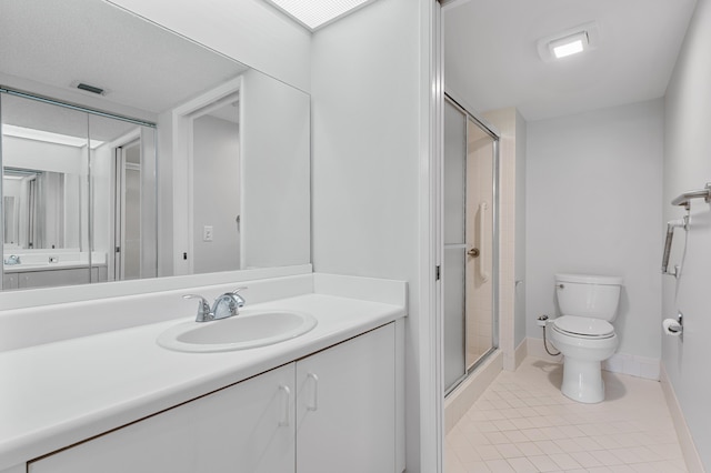 bathroom with walk in shower, toilet, vanity, and tile patterned flooring