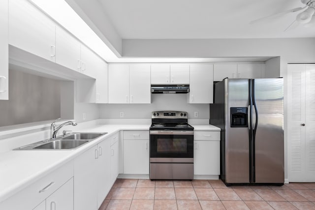 kitchen with range hood, white cabinets, and stainless steel appliances