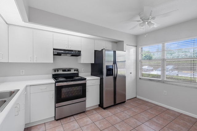 kitchen with light tile patterned floors, white cabinets, stainless steel appliances, and exhaust hood