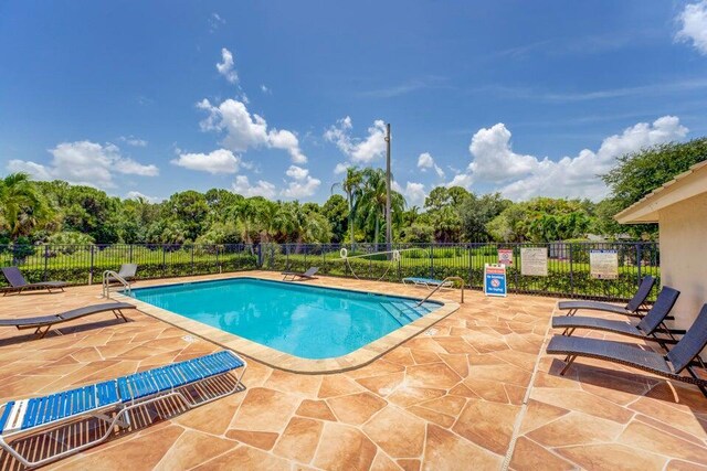 view of swimming pool featuring a patio