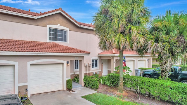 mediterranean / spanish-style home featuring a garage