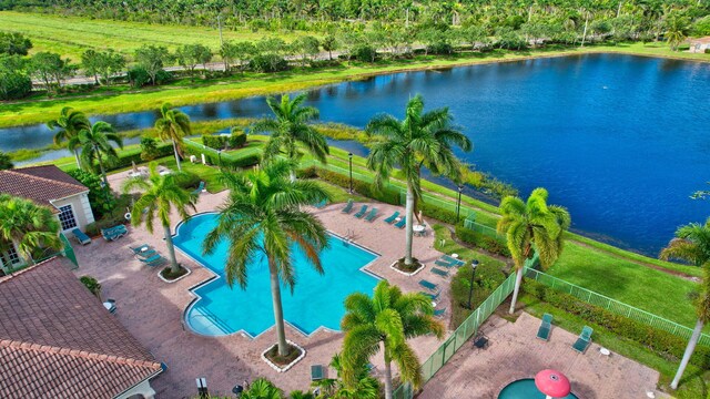 birds eye view of property with a water view