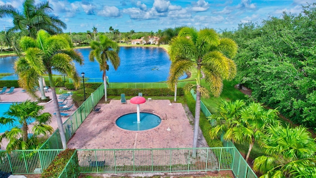 view of pool featuring a jacuzzi and a water view