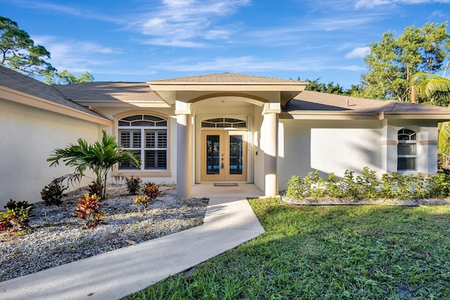 entrance to property with a yard