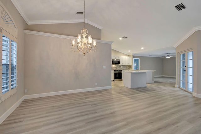 unfurnished living room featuring ceiling fan with notable chandelier, vaulted ceiling, light hardwood / wood-style flooring, and ornamental molding