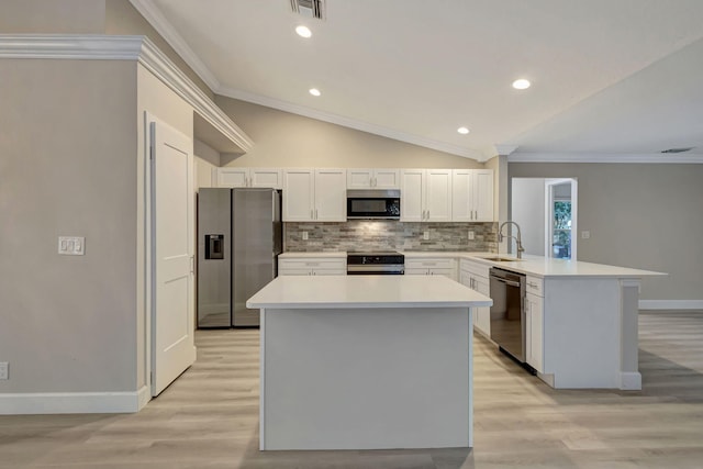 kitchen with french doors, sink, stainless steel appliances, light hardwood / wood-style flooring, and kitchen peninsula