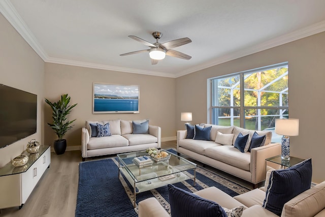 living room featuring light wood-type flooring, ceiling fan, and crown molding