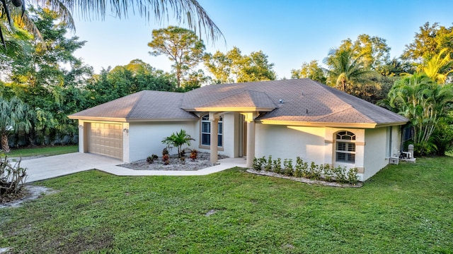 single story home with a front lawn and a garage