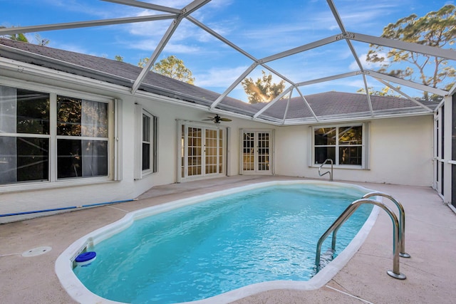 view of pool featuring a lanai, a patio area, and ceiling fan