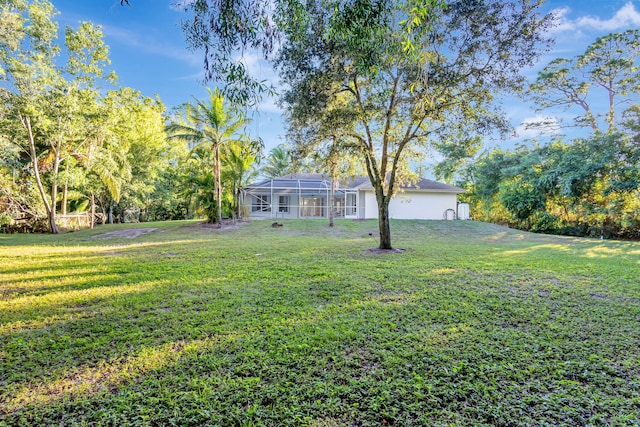 view of yard featuring a lanai