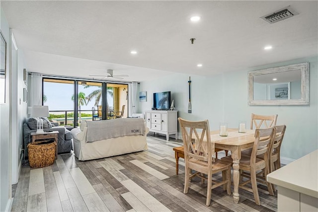 dining space featuring ceiling fan and light hardwood / wood-style floors