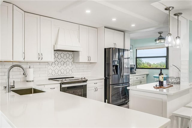 kitchen featuring custom range hood, stainless steel appliances, pendant lighting, and backsplash