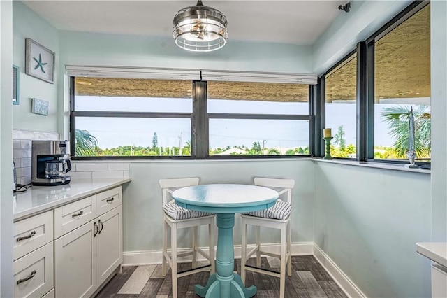 interior space featuring white cabinetry and hardwood / wood-style floors