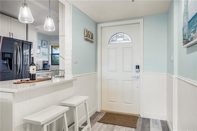 entrance foyer featuring light hardwood / wood-style floors