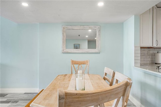 dining room with hardwood / wood-style floors