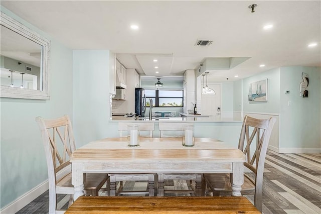 dining room featuring light hardwood / wood-style floors