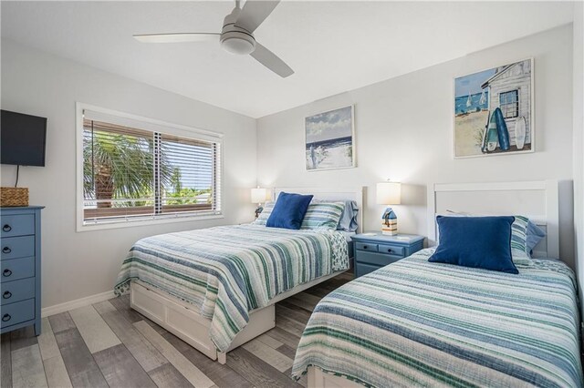 bedroom with ceiling fan and hardwood / wood-style flooring