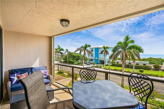 balcony featuring a water view