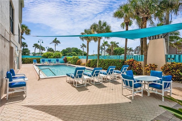 view of swimming pool featuring a patio