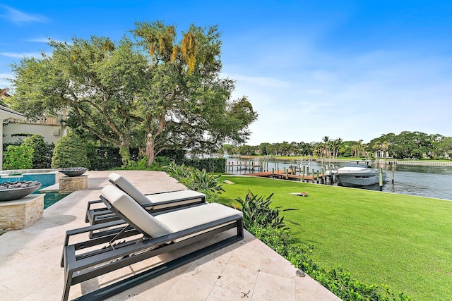 view of patio / terrace featuring a dock and a water view