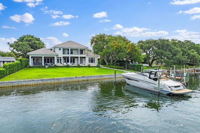 dock area featuring a yard and a water view