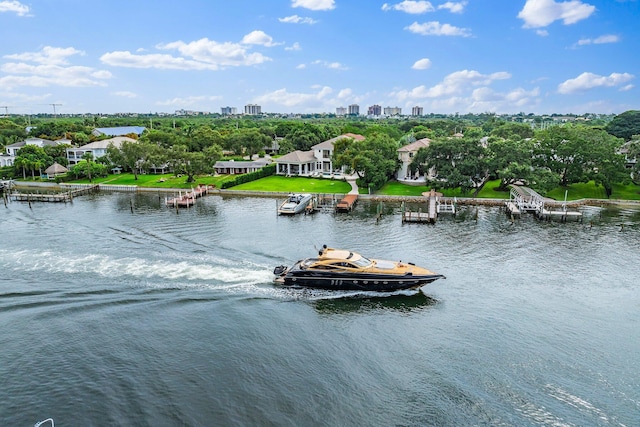 13209 Rolling Green Rd, North Palm Beach, FL 33408 - water view featuring a floating dock and a tree filled landscape